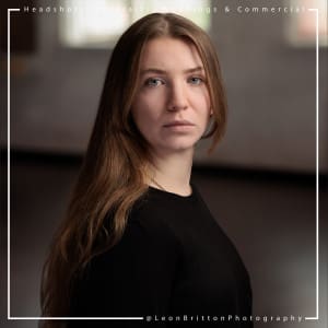 Creative headshot of a young professional in an working environment