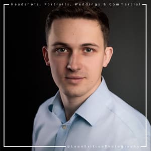 Studio headshot of a man with a serious expression for corporate profile