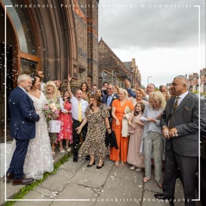 Professional wedding photographer in action in Liverpool
