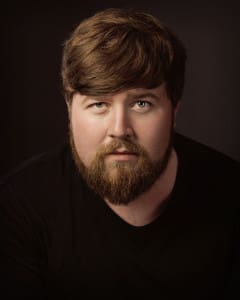 A dramatic headshot of an actor with cinematic lighting, perfect for casting directors and portfolios.